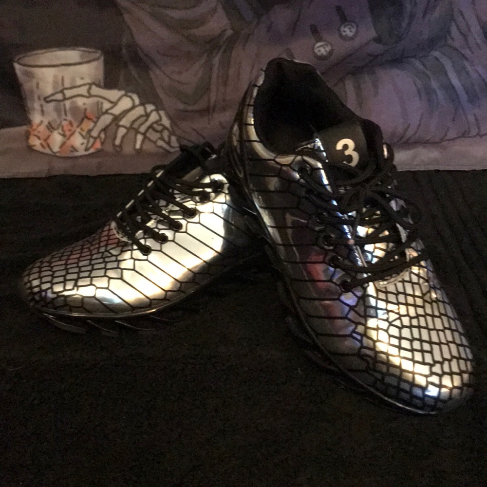 Shiny silver and black running shoes.